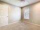 Bedroom with neutral walls, ceiling fan, and a window with blinds for natural light at 2641 Delcrest Dr, Orlando, FL 32817