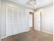 Carpeted bedroom with large closet and a door leading to another room at 2641 Delcrest Dr, Orlando, FL 32817