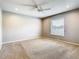 Bedroom featuring neutral carpet, ceiling fan, and a window at 2641 Delcrest Dr, Orlando, FL 32817