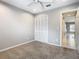 Bedroom with standard closet, carpet and a doorway to another room at 2641 Delcrest Dr, Orlando, FL 32817