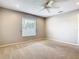 Carpeted bedroom with a window and neutral walls at 2641 Delcrest Dr, Orlando, FL 32817