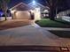 Charming single-Gathering home with a two-car garage, brick walkway, and well-manicured lawn at night at 2641 Delcrest Dr, Orlando, FL 32817