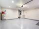 Spacious garage with epoxy flooring, ample lighting, and a convenient water heater at 2641 Delcrest Dr, Orlando, FL 32817
