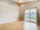 Inviting living room features high ceilings, fan, and sliding glass door to the backyard at 2641 Delcrest Dr, Orlando, FL 32817