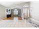 Spacious living room with hardwood floors and large windows that provide ample natural light at 2641 Delcrest Dr, Orlando, FL 32817