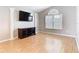 Light-filled living room with hardwood floors, large windows, and decorative columns for added elegance at 2641 Delcrest Dr, Orlando, FL 32817