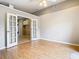 Open-concept living room offers french doors that lead to the kitchen area and wood flooring at 2641 Delcrest Dr, Orlando, FL 32817
