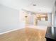 Bright living room with wood floors offers a seamless transition into the adjacent dining area at 2641 Delcrest Dr, Orlando, FL 32817