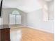 Bright living room featuring hardwood floors, large windows, and neutral paint, creating a cozy atmosphere at 2641 Delcrest Dr, Orlando, FL 32817