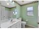 Bathroom features a single vanity, toilet, and shower-tub combo at 26908 Honeymoon Ave, Leesburg, FL 34748