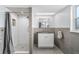 Stylish bathroom featuring white subway tiles in shower with mosaic floor and modern vanity at 3024 Saratoga Dr, Orlando, FL 32806