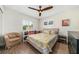 Cozy bedroom showcasing natural light, modern ceiling fan, and comfortable sleeping area at 3024 Saratoga Dr, Orlando, FL 32806