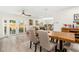Bright dining area with wood table, stylish chairs, and sliding doors to outdoor space at 3024 Saratoga Dr, Orlando, FL 32806