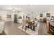 Open dining area with a wooden table, bench, and stylish decor, seamlessly connected to the kitchen at 3024 Saratoga Dr, Orlando, FL 32806