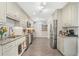 Kitchen with granite countertops, stainless steel appliances, and white cabinets at 3024 Saratoga Dr, Orlando, FL 32806