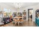Cozy living area with round table and chairs, complemented by stylish shelving units at 3024 Saratoga Dr, Orlando, FL 32806