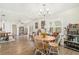 Inviting living area with a round table, charming chandelier, and view of bookshelves at 3024 Saratoga Dr, Orlando, FL 32806