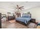 Serene main bedroom with a spacious bed, a ceiling fan, and natural light at 3024 Saratoga Dr, Orlando, FL 32806