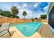 Large swimming pool surrounded by lush landscaping and lounge chairs in the backyard at 3024 Saratoga Dr, Orlando, FL 32806