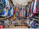 Bright walk-in closet features custom shelving and ample storage for clothes, shoes, and accessories at 3024 Saratoga Dr, Orlando, FL 32806