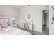 Bright bedroom featuring a cozy bed, decorative accents, and a stylish desk area at 3081 Viceroy Ct, Poinciana, FL 34759