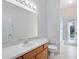 The bathroom features a nice mirror, sink, toilet, and tub/shower combo at 315 Belhaven Falls Dr, Ocoee, FL 34761