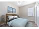 Cozy bedroom features natural light, carpet, and soothing colors to help you relax at 315 Belhaven Falls Dr, Ocoee, FL 34761