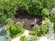 Aerial view of a charming community playground surrounded by lush trees and landscaping at 315 Belhaven Falls Dr, Ocoee, FL 34761