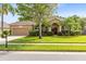 Charming one-story home with a well-manicured lawn, mature trees, and a two-car garage at 315 Belhaven Falls Dr, Ocoee, FL 34761