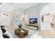 Bright living room featuring neutral walls, tile flooring, modern furniture, and elegant archways at 315 Belhaven Falls Dr, Ocoee, FL 34761