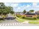 Welcome to Brookestone: A well-maintained neighborhood entrance with lush landscaping and an automatic gate at 315 Belhaven Falls Dr, Ocoee, FL 34761