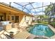 Beautiful screened-in pool area with lounge chairs, perfect for relaxation and outdoor entertainment at 315 Belhaven Falls Dr, Ocoee, FL 34761