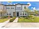 Charming townhome featuring blue and gray exterior, manicured lawn, and inviting curb appeal at 3303 Azolla St, Orlando, FL 32808