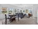 Open floor plan features living and dining areas with plentiful natural light and neutral tones at 3303 Azolla St, Orlando, FL 32808