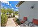 Cozy side yard seating area with chairs and landscaping at 3303 Azolla St, Orlando, FL 32808