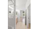 Bright bathroom boasts a large mirror, tiled floors and a bath with a shower at 3419 Fernwood Dr, Kissimmee, FL 34741
