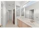 Bathroom features a single sink vanity, a clerestory window, and a walk in shower and toilet at 3419 Fernwood Dr, Kissimmee, FL 34741