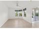 Bright bedroom featuring multiple windows with garden views at 3419 Fernwood Dr, Kissimmee, FL 34741