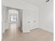 Bedroom with tiled floors and view to living space at 3419 Fernwood Dr, Kissimmee, FL 34741
