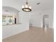 Spacious dining area with tiled flooring and adjacent kitchen view at 3419 Fernwood Dr, Kissimmee, FL 34741