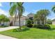 Beautiful home with a landscaped yard and mature trees at 3419 Fernwood Dr, Kissimmee, FL 34741
