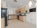 Open kitchen with stainless steel appliances and ample counter space at 3419 Fernwood Dr, Kissimmee, FL 34741