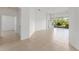 Bright living room with tile floors, ceiling fan and slider to screened lanai at 3419 Fernwood Dr, Kissimmee, FL 34741