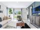 Cozy living room with comfortable seating and sliding glass door to backyard at 3665 Fort Mellon Ln, Sanford, FL 32773