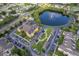 Aerial view of apartment complex with parking, pond with fountain, and professional landscaping at 3707 Conroy Rd # 1715, Orlando, FL 32839