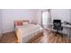 Bedroom with natural light and ample space for a desk with wood-look floors at 3707 Conroy Rd # 1715, Orlando, FL 32839