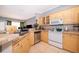 Kitchen with stainless steel dishwasher, white ceramic top stove, and breakfast bar at 3707 Conroy Rd # 1715, Orlando, FL 32839