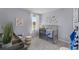 Cozy Bedroom with a gray crib, ocean-themed decor, and natural light from the window at 3711 Bluethread Way, Poinciana, FL 34759