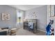 Bright Bedroom with a cozy crib, nautical decor, and a view from the window at 3711 Bluethread Way, Poinciana, FL 34759