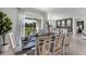 Open dining area features a large window with views of the scenic backyard pond at 3711 Bluethread Way, Poinciana, FL 34759